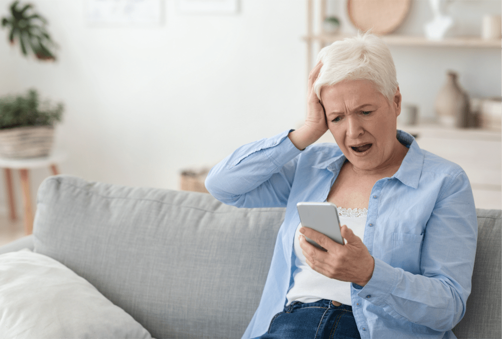 woman senior shocked w cellphone